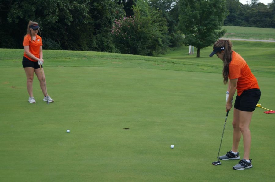 Madison Hasemeyer looks on as Kayla Bert putts in the match against Zeigler-Royalton.