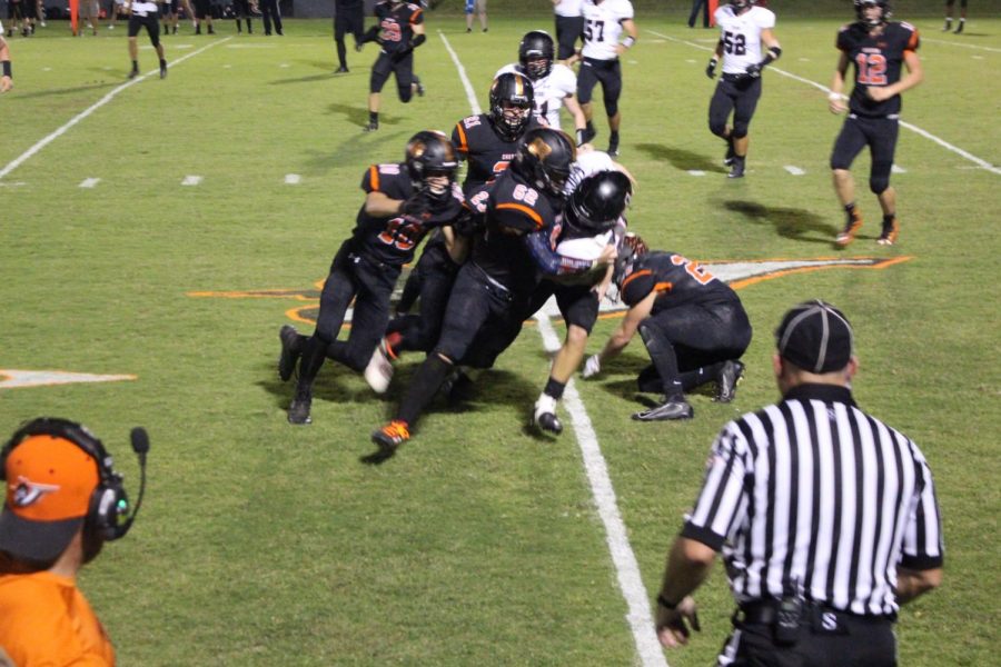 Jacob Miller tackles a Johnston City runner in the Chester win Sept. 27.