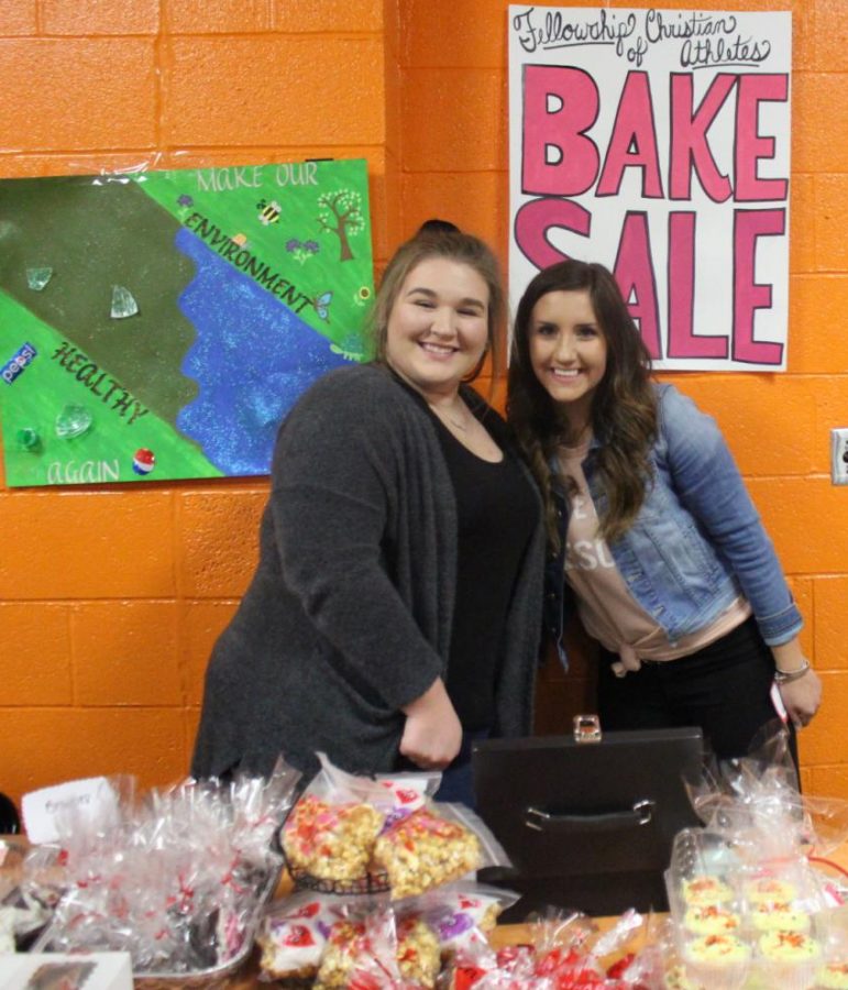 Mabry Miles and Ryn Petrowske helped with the Fellowship of Christian Athletes bake sale during the Chester-Carbondale game.