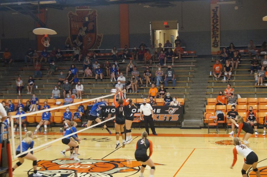 Kailyn Absher and Alyssa Seymour make a block in the win over Spartsa.