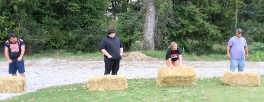 Jerald Copple (right) defended his title in the hay bale toss.