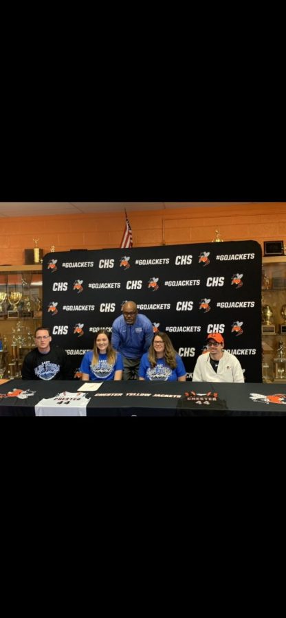 Alyssa Seymour (front row, second from left) signs a letter of intent to play basketball at Southwestern Illinois College.