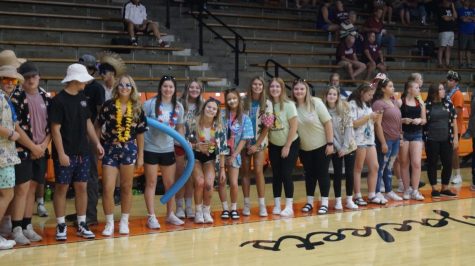 The Hive had a tropical theme as they cheered on the volleyball team against Red Bud.