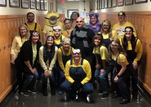 Principal Gru Blechle is surrounded by his minion staff.