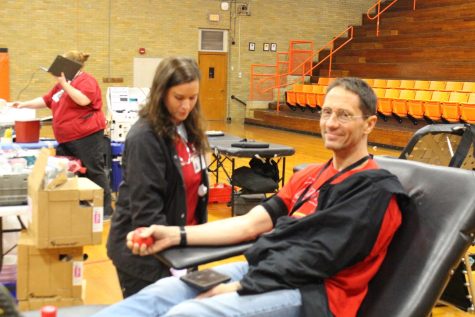Mr. Lochhead donates blood at the blood drive.