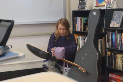 Jenny Devolt gets out her guitar to play some songs