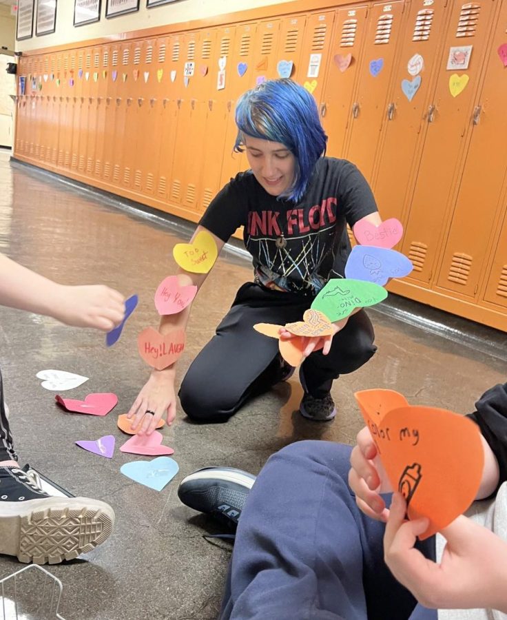 Kerringtyn Malley organizes hearts for the Art Club Valentines Day project.