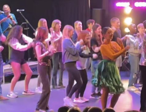 Students dance on the stage