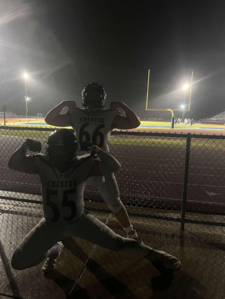 Chester lineman Nate Maes #55 and Alex Williamson #66 flex after Chester's win. 