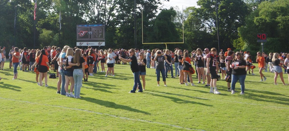 Fans meet and greet Fall Sports players on the field