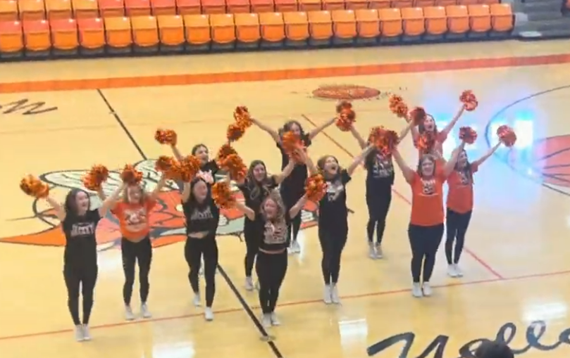 CHS Cheerleaders teach "Let's Get Fired Up!" to the crowd 