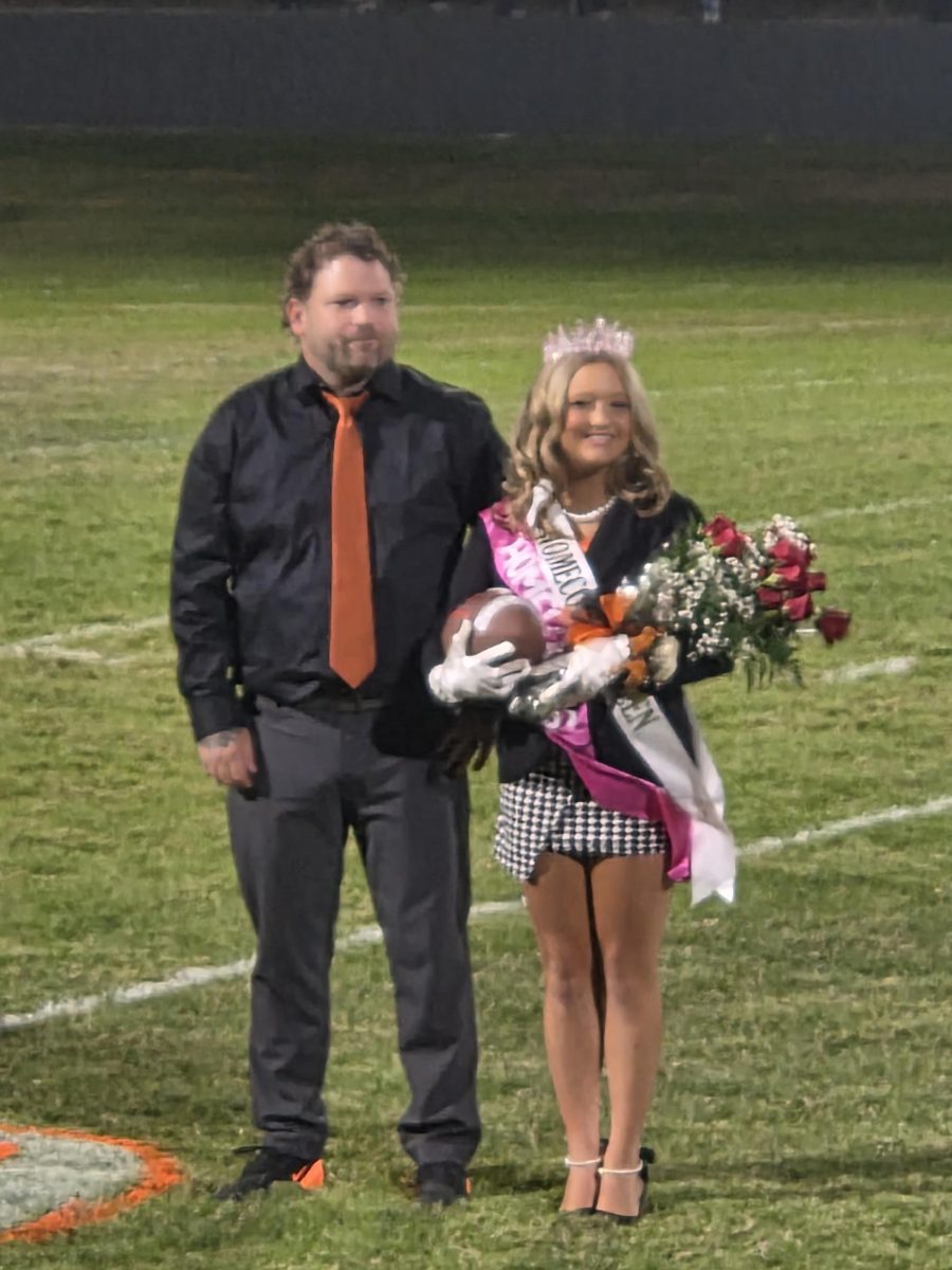 Queen Callie Davis escorted by her dad Justin Davis