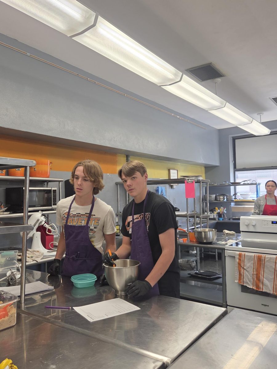 Zane Eggemeyer and Kross Jany working hard at making cookie dough