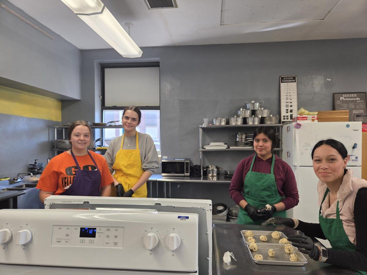 Zoey Tucker, Hayden Gibbs, Iraisa Lorenzo, and Tasia Foulks working hard at making chocolate chip cookies for conferences. 
