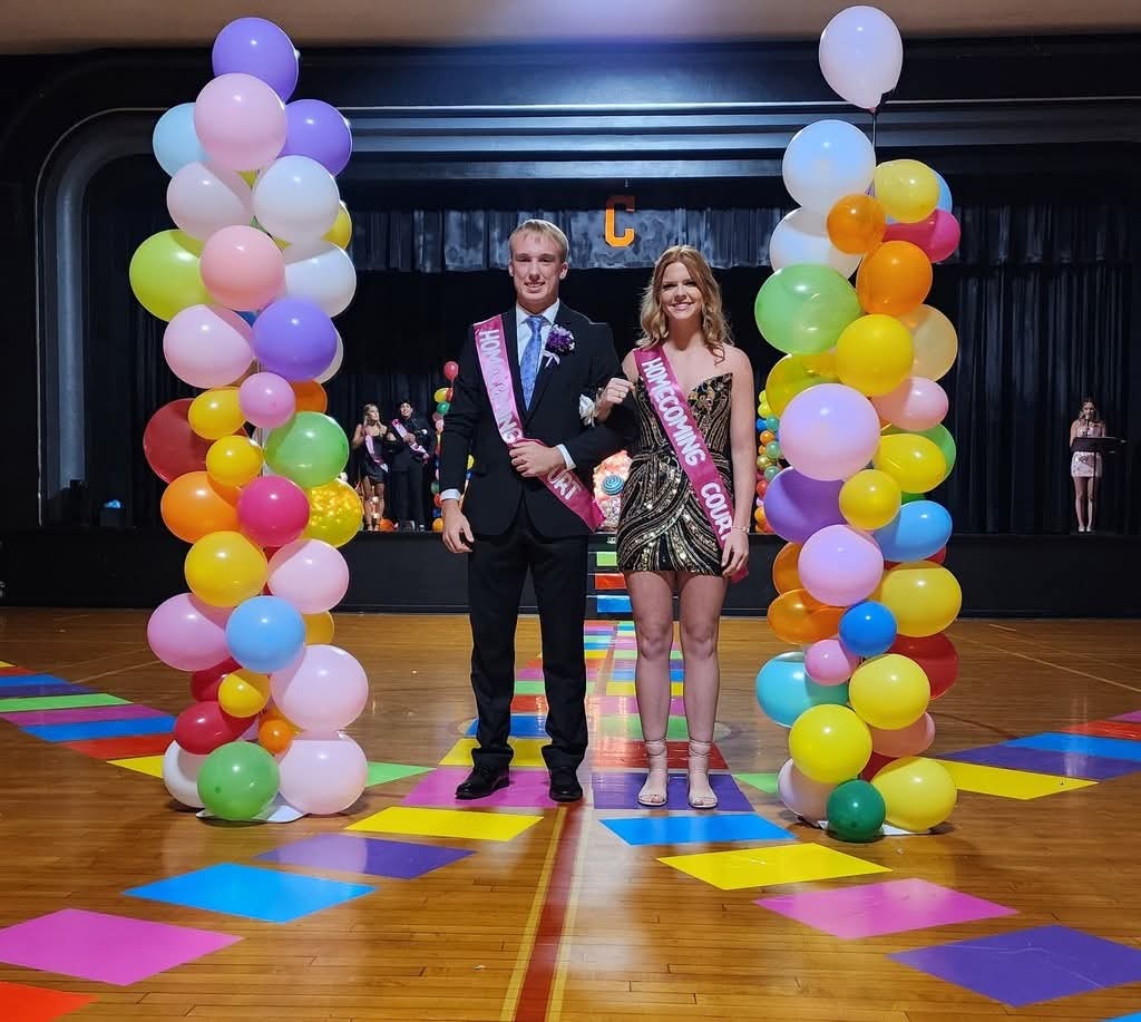 Maggie Caby with her escort Ethan Colvis