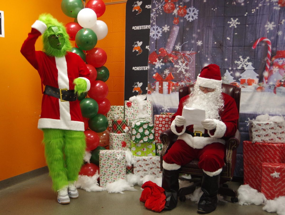 Santa checking his list and Grinch trying to stay out of trouble at the CHS Student Council Christmas event