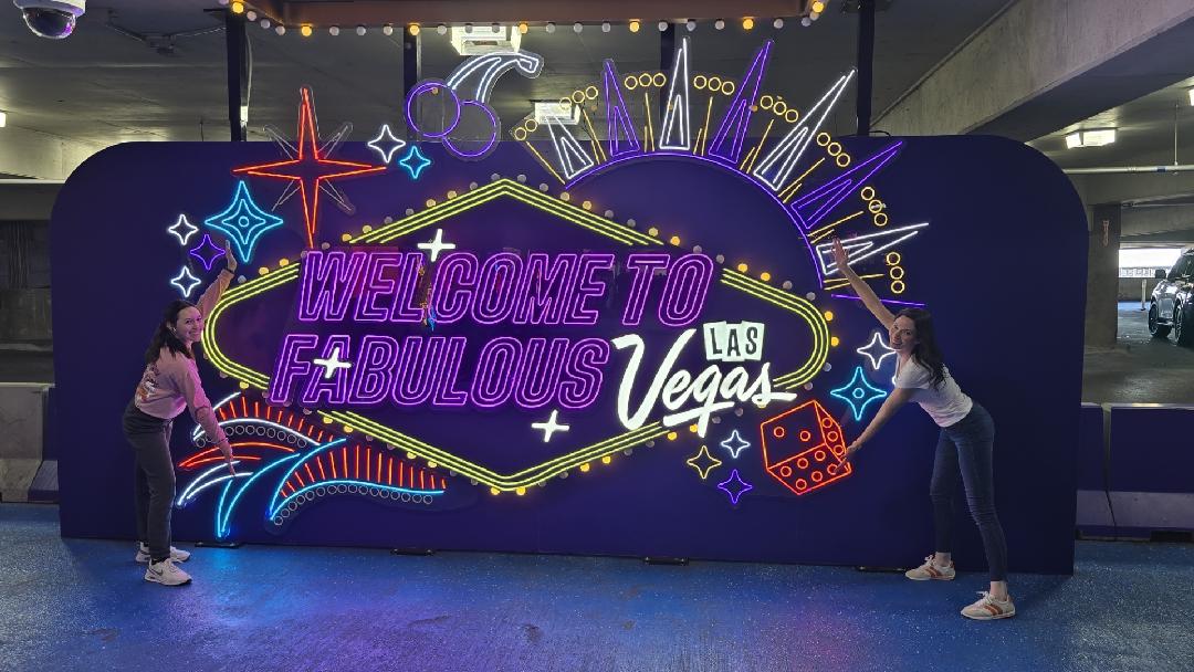 Isabel and her mom next to the "Welcome to Fabulous Las Vegas" sign near the Las Vegas airport